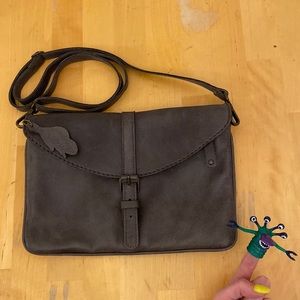 Dark purple pebble leather bad with magnetic clasp in the front